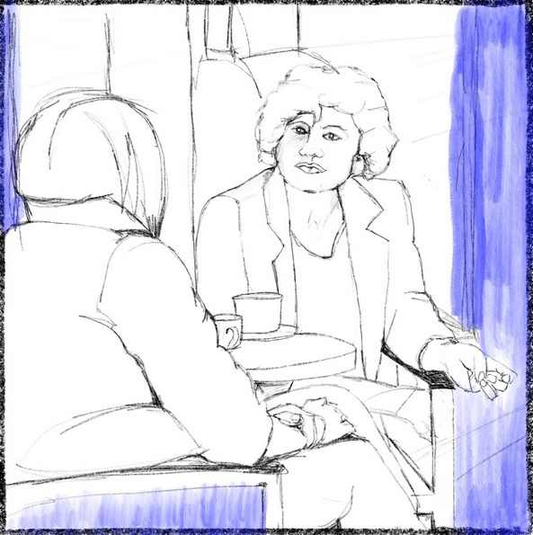 Zwei Personen zitzen im Cafe. Die eine hört der anderen aufmerksam zu.